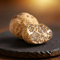Fresh Tuber borchii EXTRA Grade truffles showing pale interior and fine natural white marbling