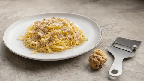 Fresh Tuber borchii EXTRA Grade shaved over warm tagliolini with butter and mild cheese