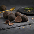 Fresh Tuber melanosporum A Grade truffles showing the dark marbled interior