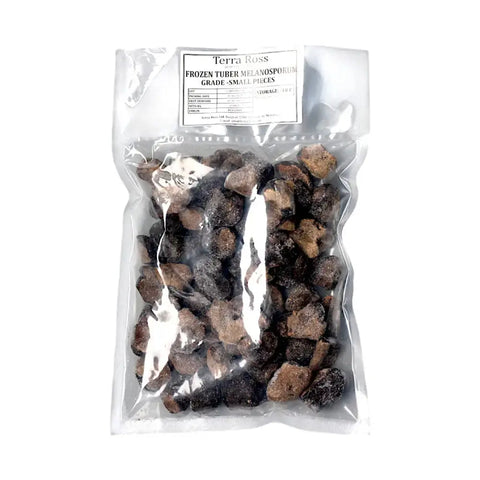 Bag of frozen black truffle pieces from Tuber Melanosporum for gourmet cooking