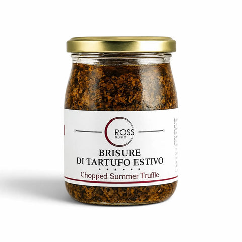 Glass jar containing minced Tuber aestivum summer truffle in olive oil