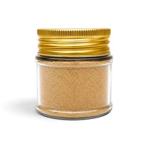 Morel powder (Morchella esculenta) in a clear glass jar with a gold lid