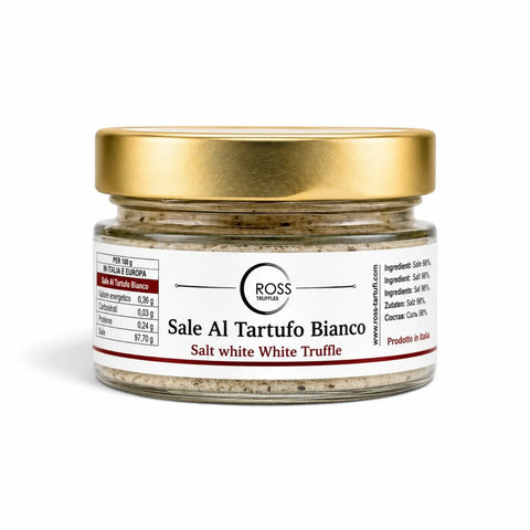 White truffle salt with truffle pieces in a 120 g glass jar with a gold lid